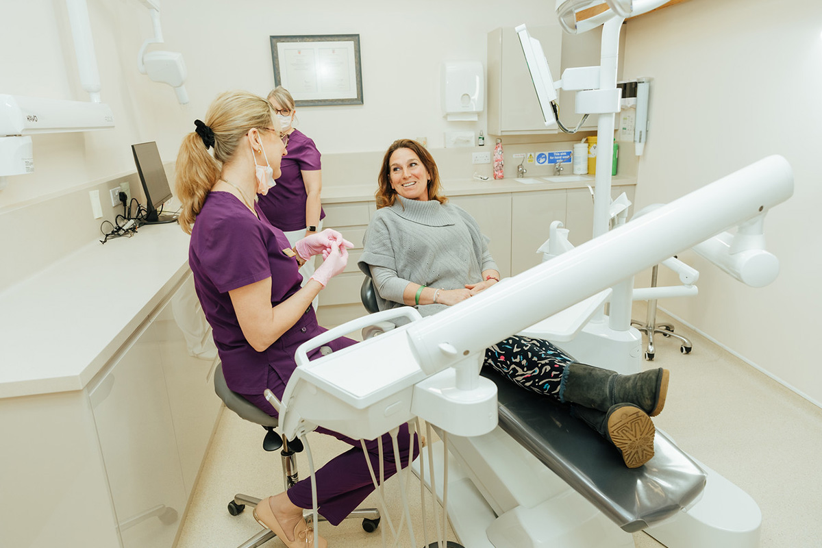 Happy patient looking in a mirror